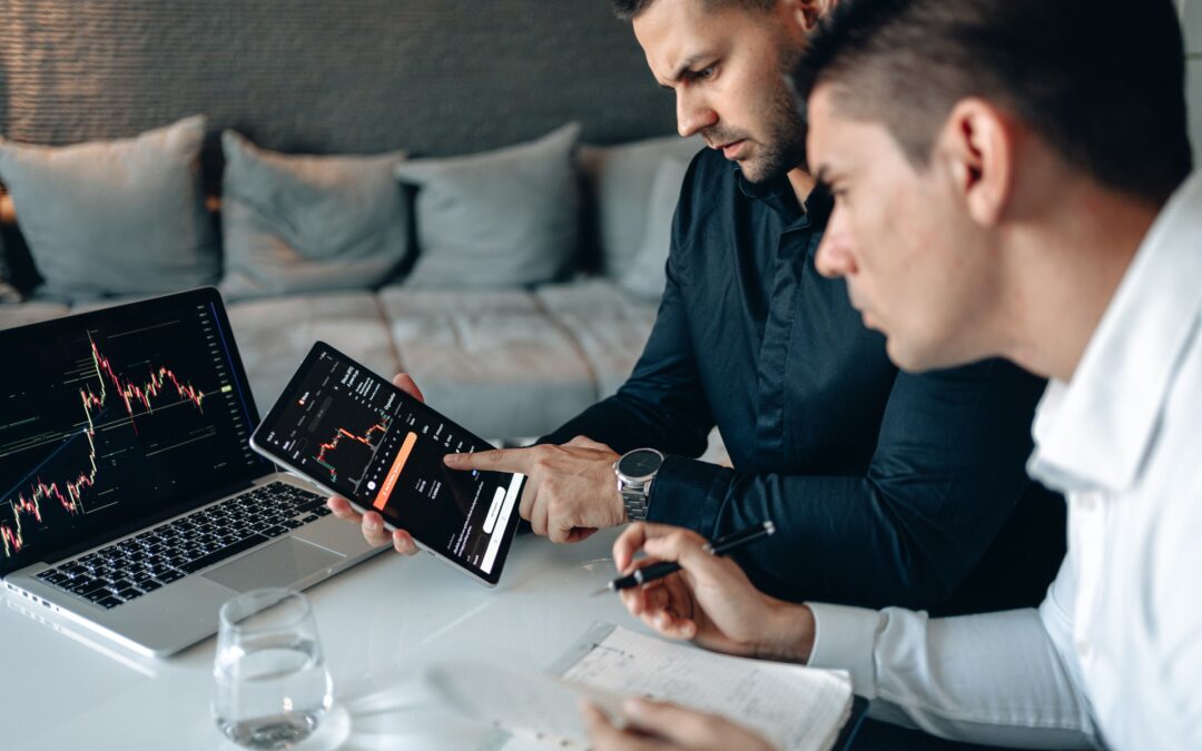 man showing tablet to other man