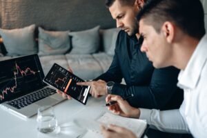 man showing tablet to other man