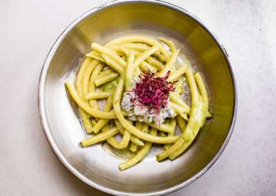 A plate of Pasta on a bowl, from the allegro restaurant