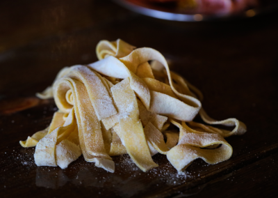 A plate of Pasta with parmesan cheese on it