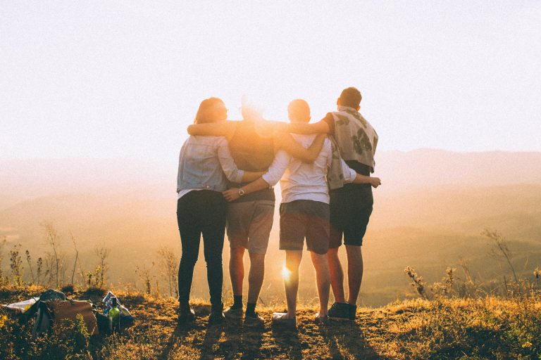 CARE Law Group clients standing together at sunset