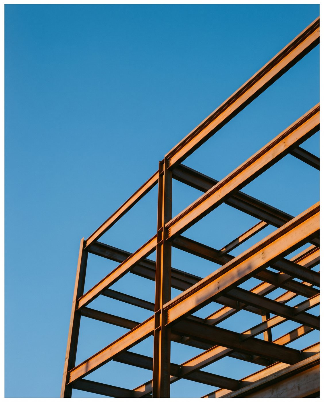 Steel frame of a commercial building against a clear California sky