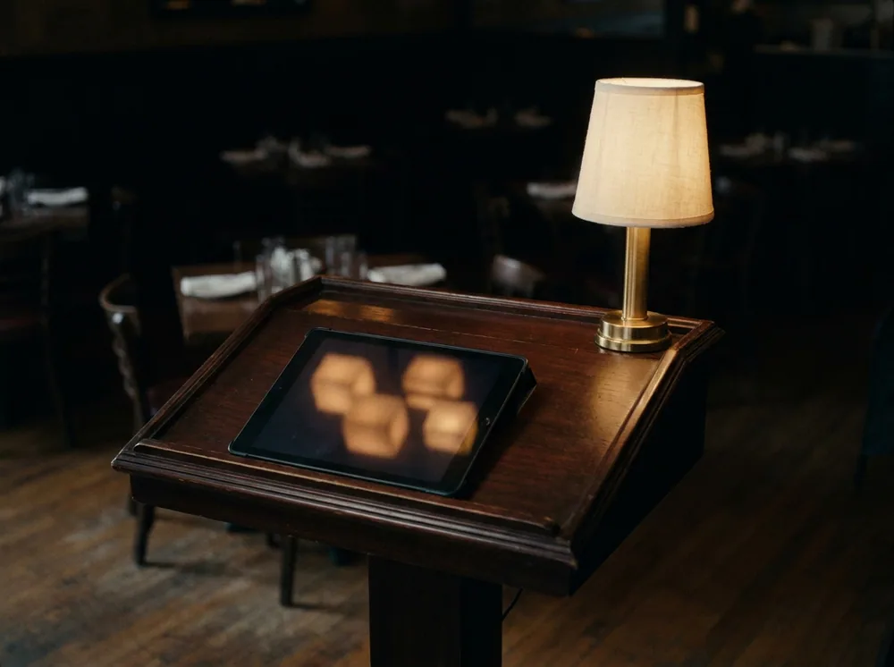 Reservation system managing covers at a restaurant host stand