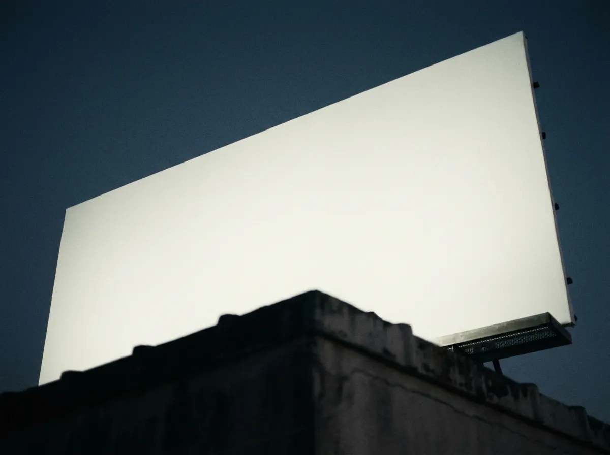 Illuminated billboard at night representing out-of-home media planning and buying in San Diego