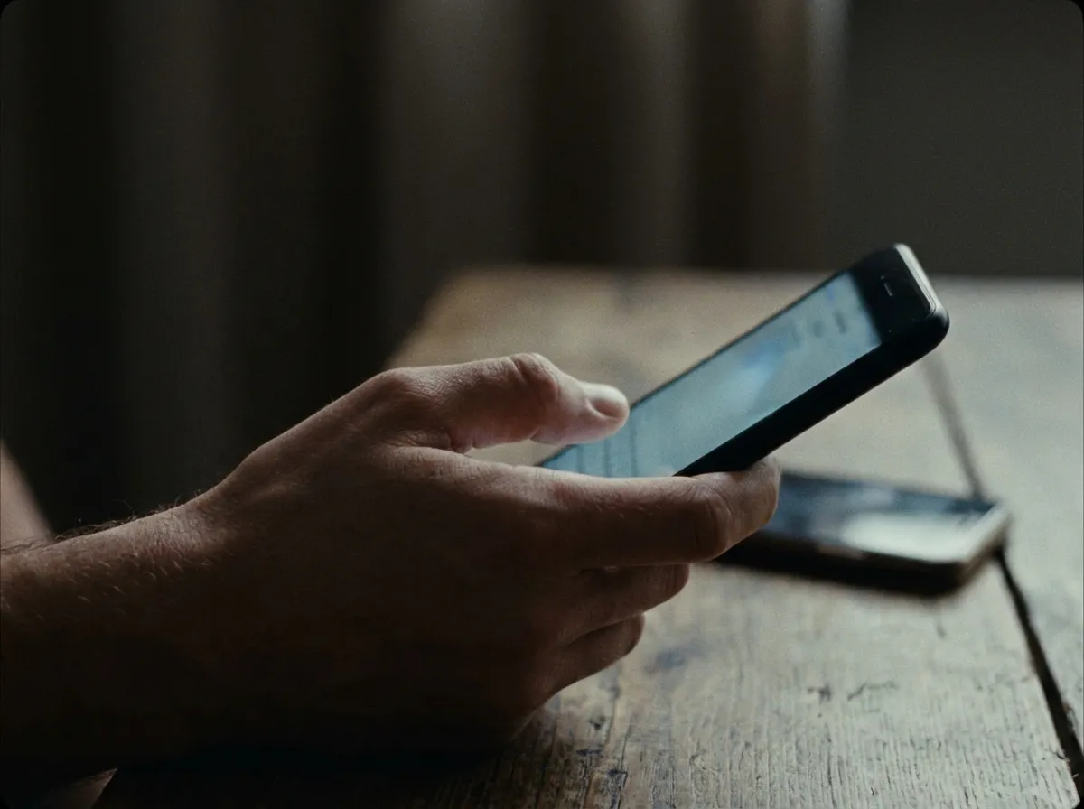 Phone in hand representing paid social advertising in San Diego